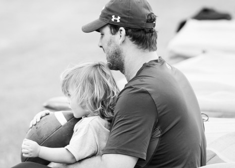 Tony Romo holds his son, Rivers (2). (Photo by Dan Garcia/The Early Registration)