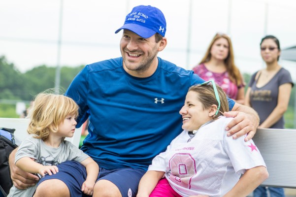 Tony Romo and son Rivers (2) meet a fan in Burlington, WI. (Photo by Dan Garcia/The Early Registration)